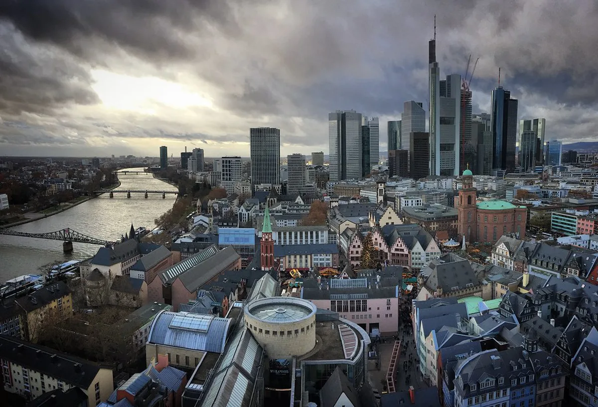 Wooden Christmas market stalls and the festive tree on Römerberg square in Frankfurt