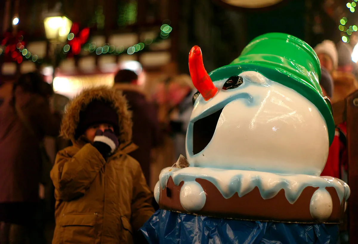 Illuminated Frankfurt Christmas market stalls glowing in the evening